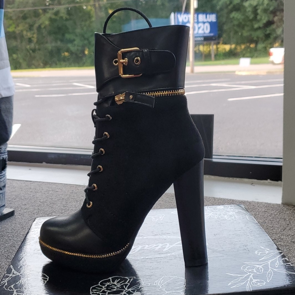 Strapped buckle boot